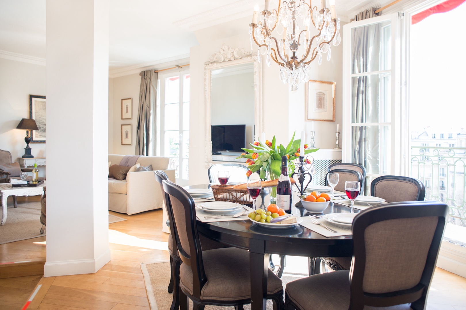 The dining table near the French doors seats up to six guests.