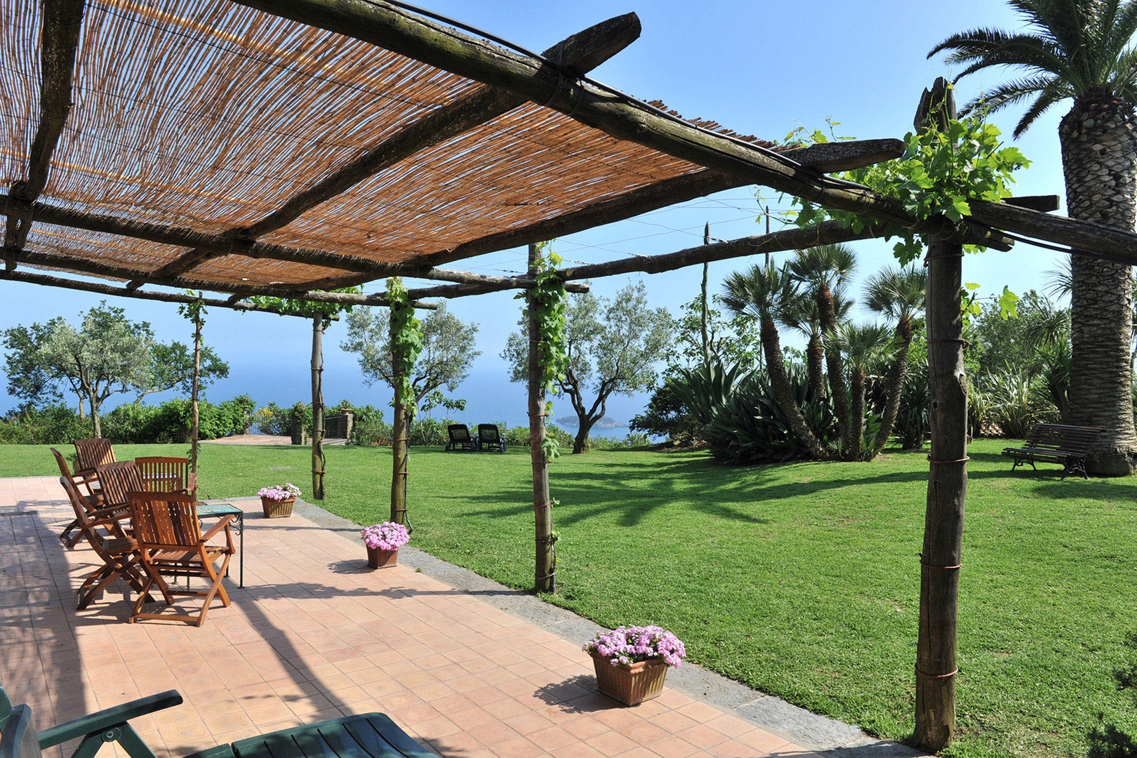 Villa Serena offers many places to relax or congregate like this large covered terrace in front.