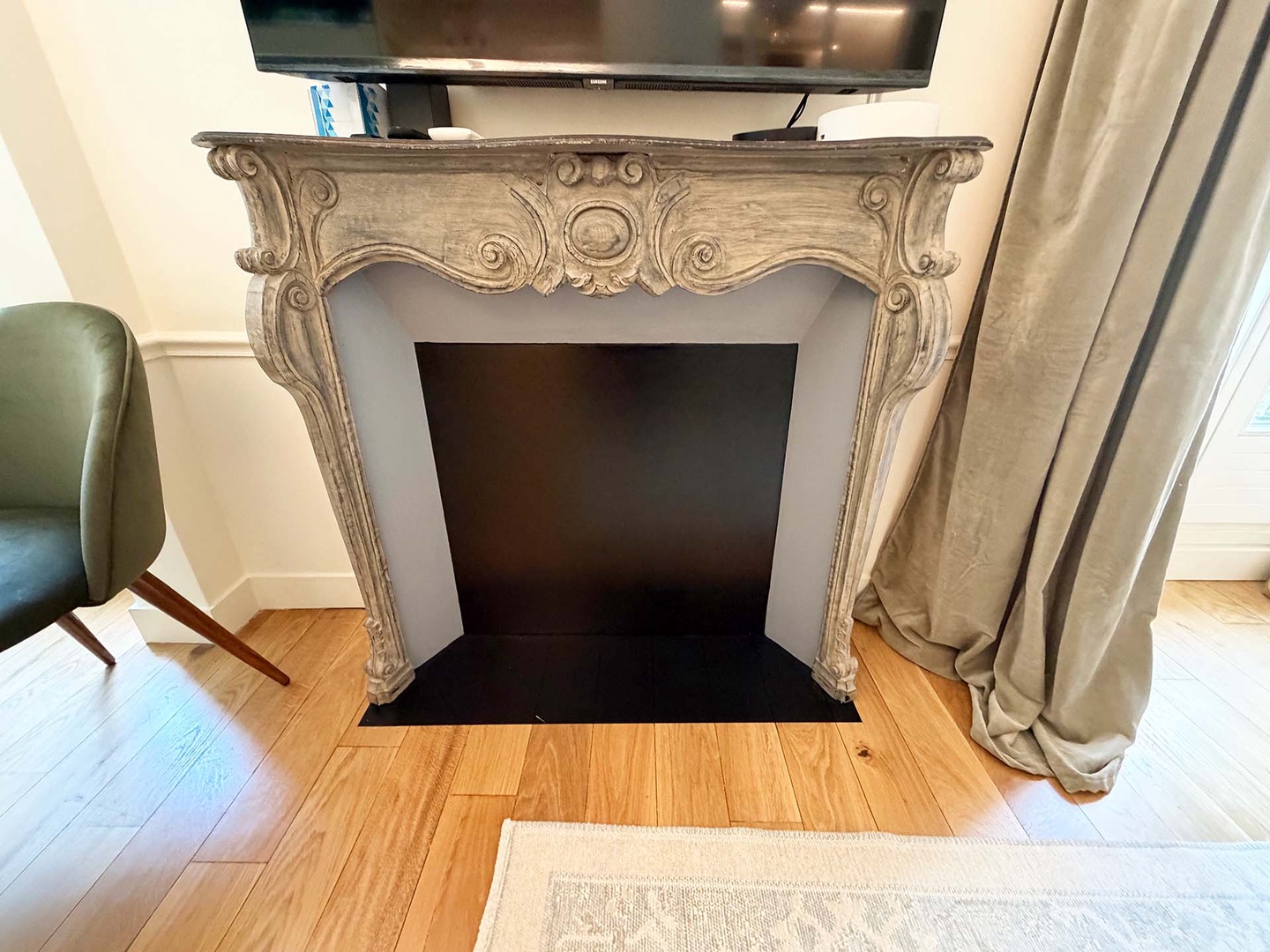Decorative fireplace adorns the living room.
