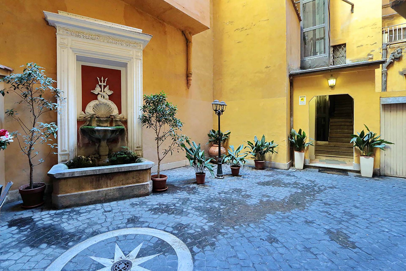 Pass by the tranquil fountain in the courtyard of Tartini Harmony