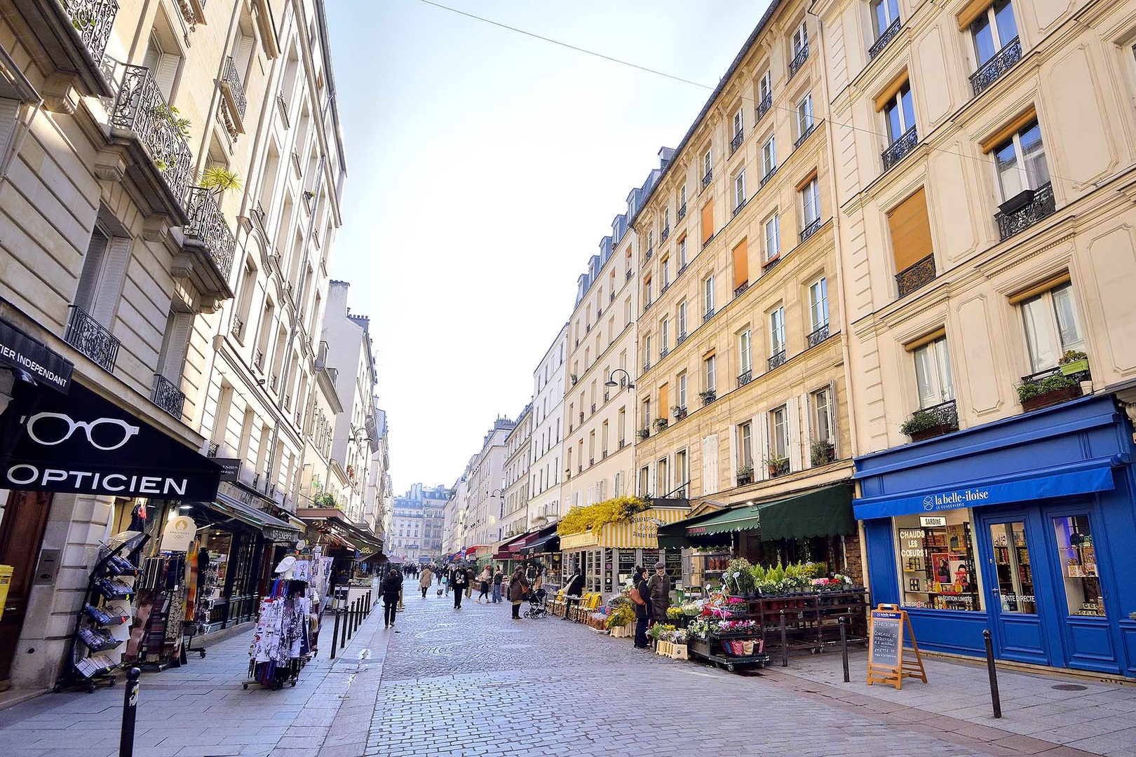 Rue Cler market street with specialty food stores, pastry shops and butchers at your doorstep.