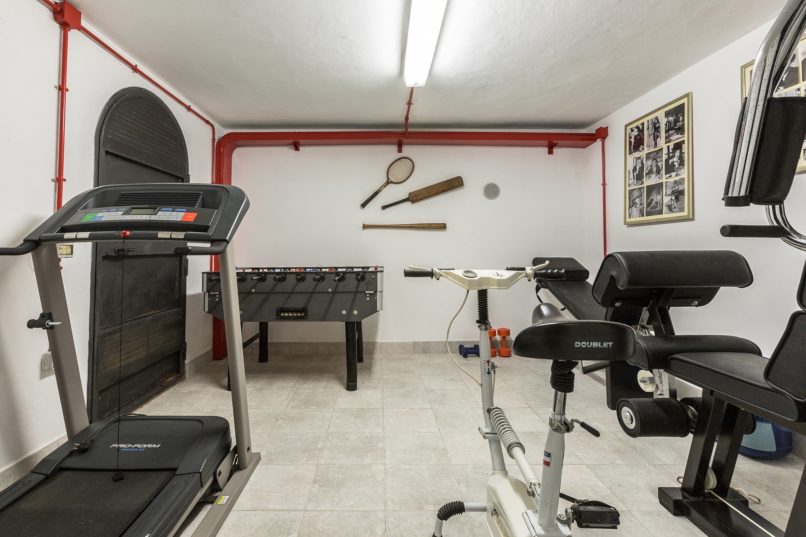 A mini gym is in the pool house located under the pool area.
