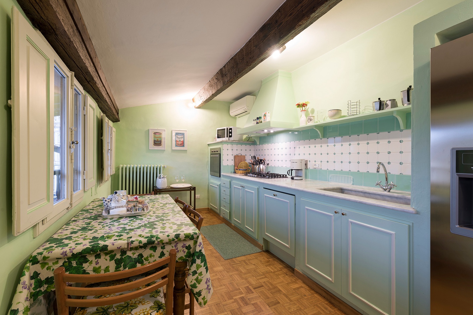 Kitchen has views of the piazza and of the Santa Croce basilica.
