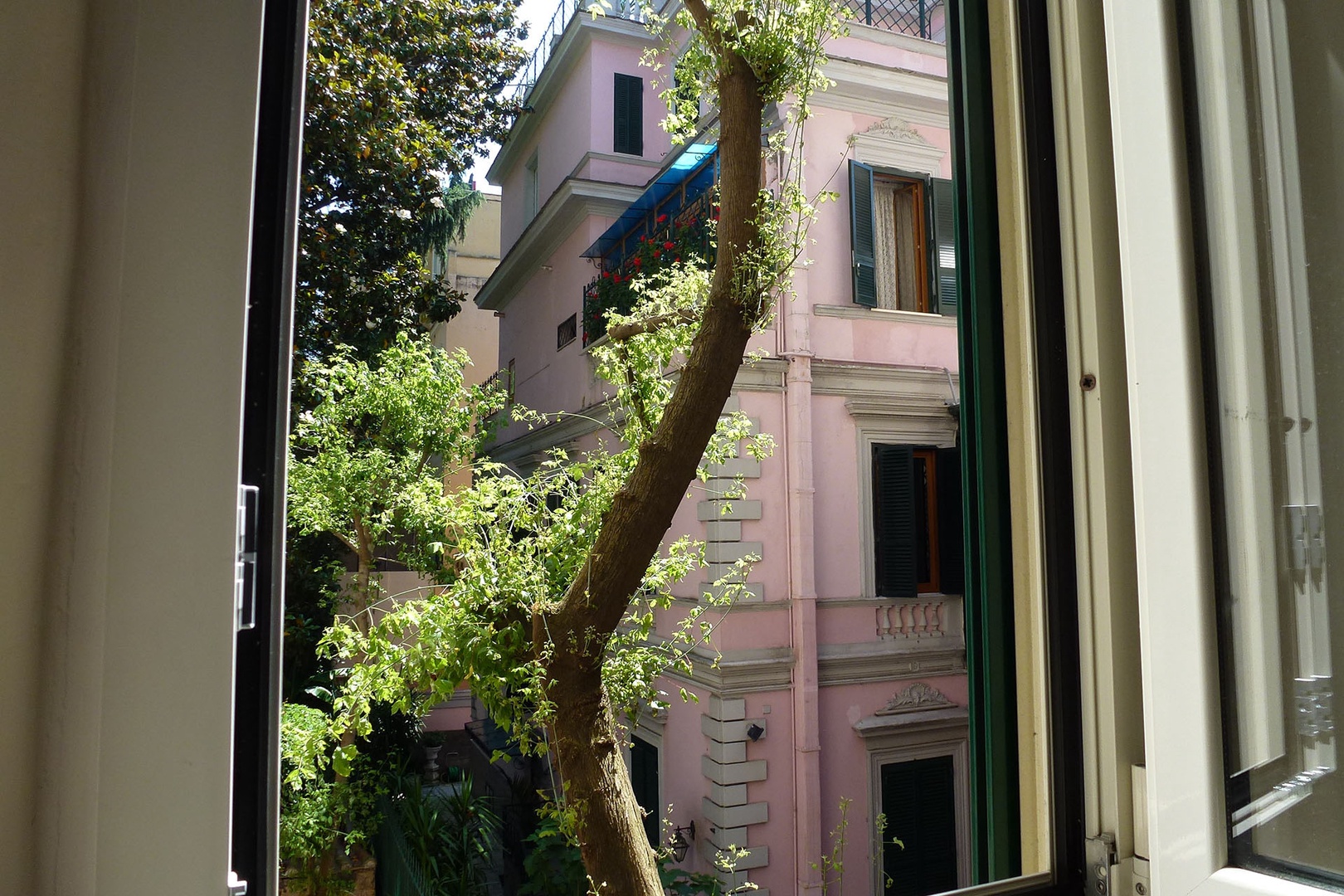 Nice views from bedroom 4 of an attractive pale pink Art Nouveau building just across the way.