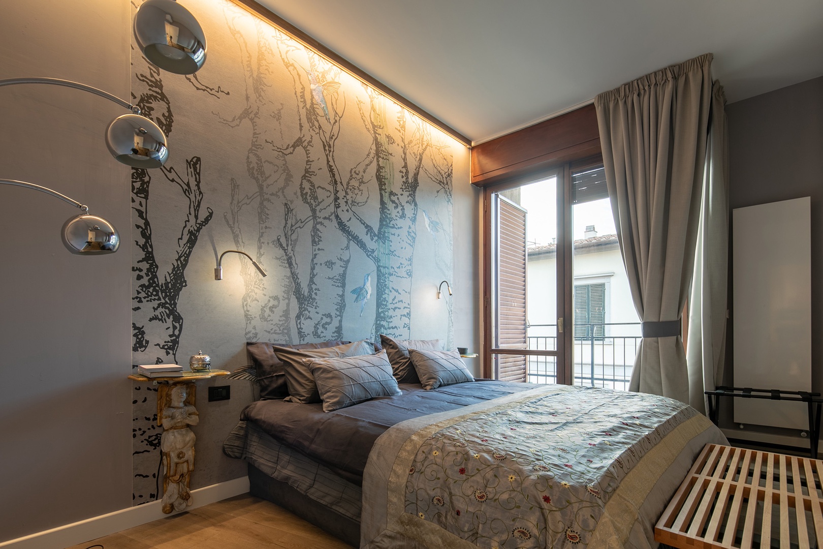 Elegantly decorated bedroom 1 with its own balcony and en suite bathroom.