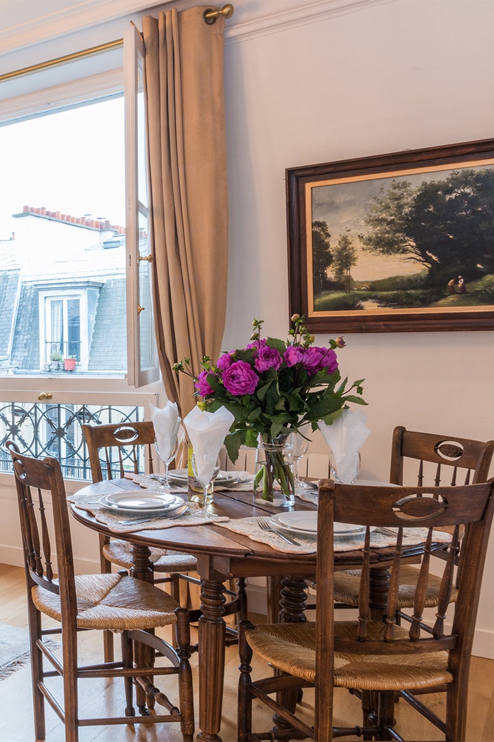 The dining table comfortably seats four people.