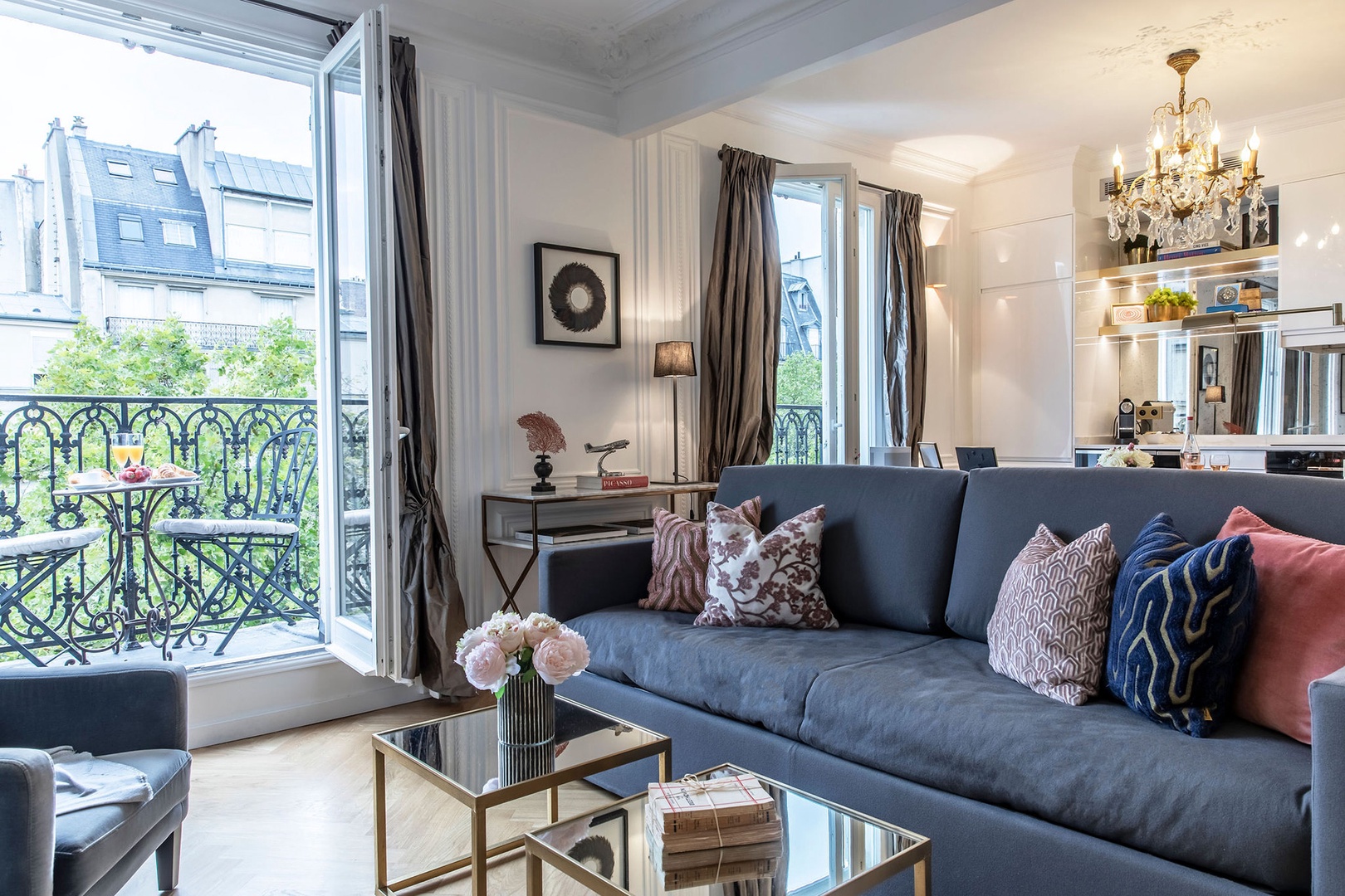 Two large French doors fill the open plan living room and kitchen with lovely light.