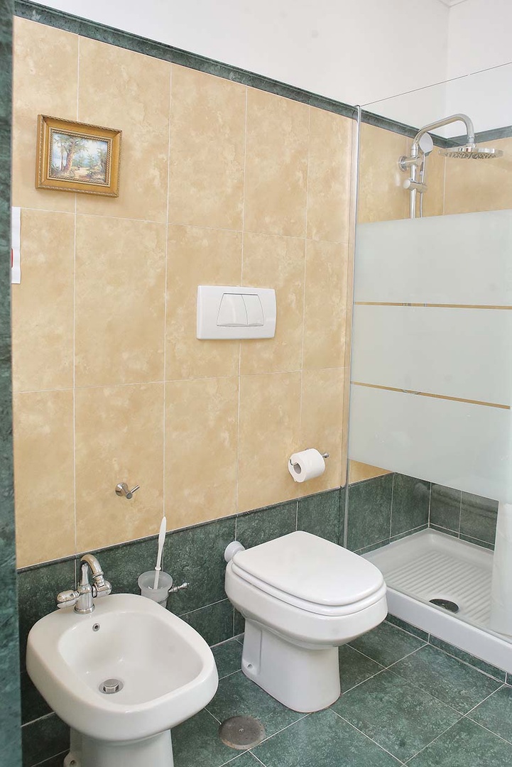 Bathroom 2 also includes a shower.