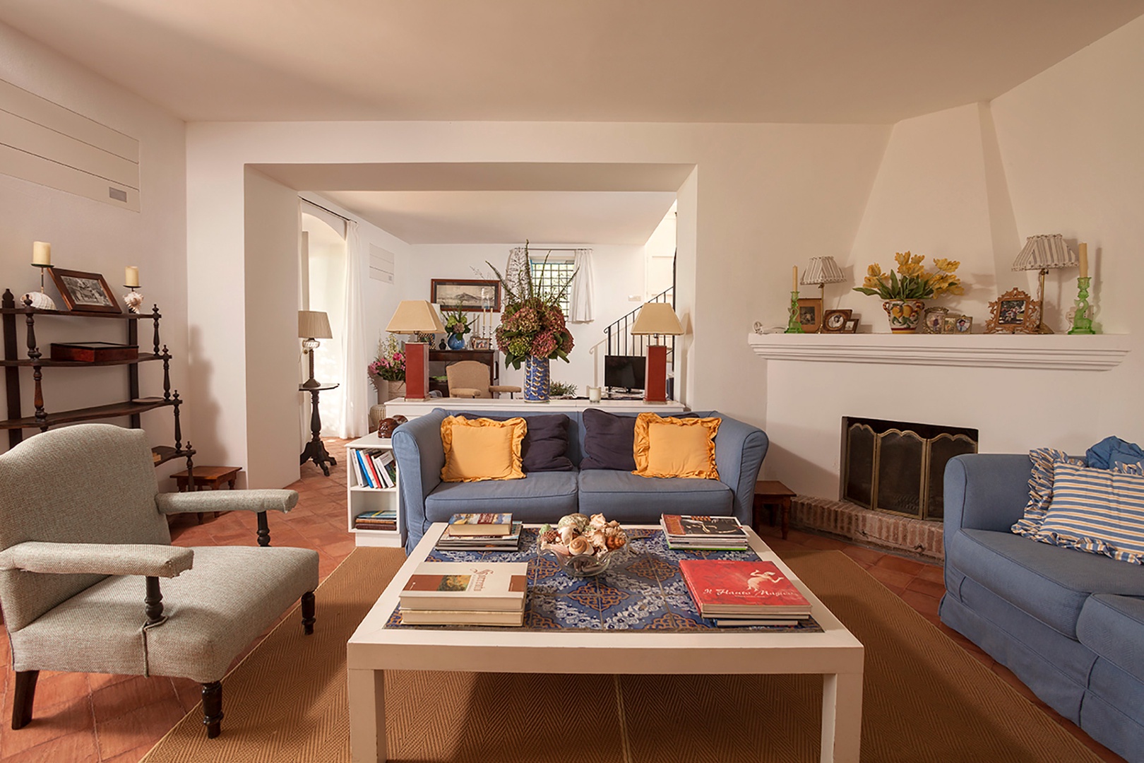 The second living room with fireplace as well as the television.