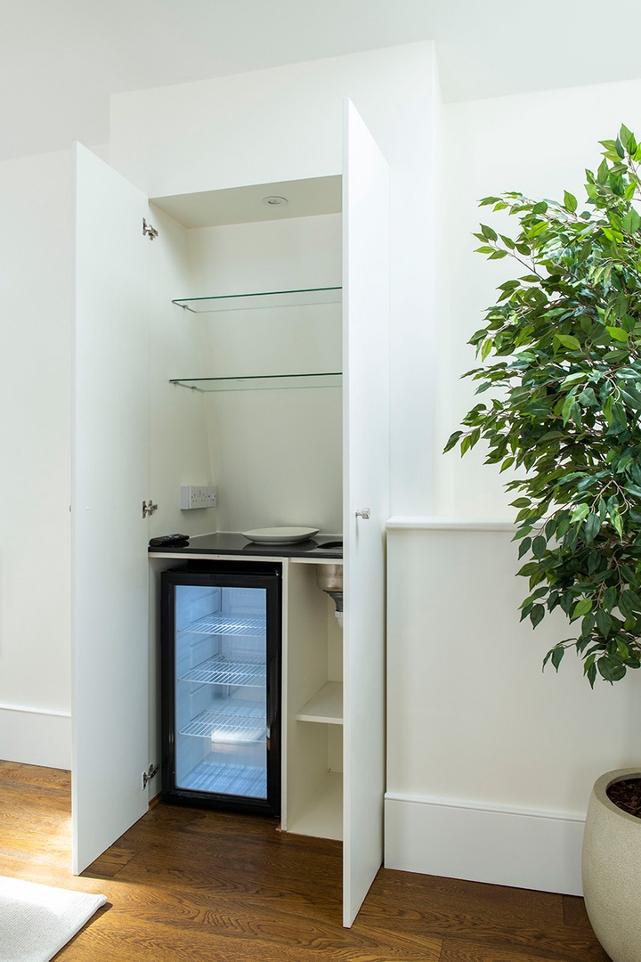 Hidden bar area in living room on upper floor.