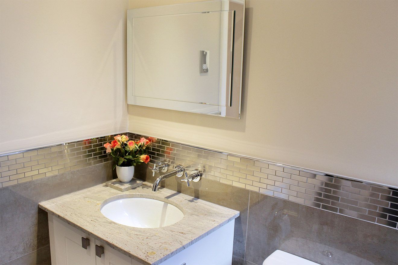 Sink with marble top and vanity mirror