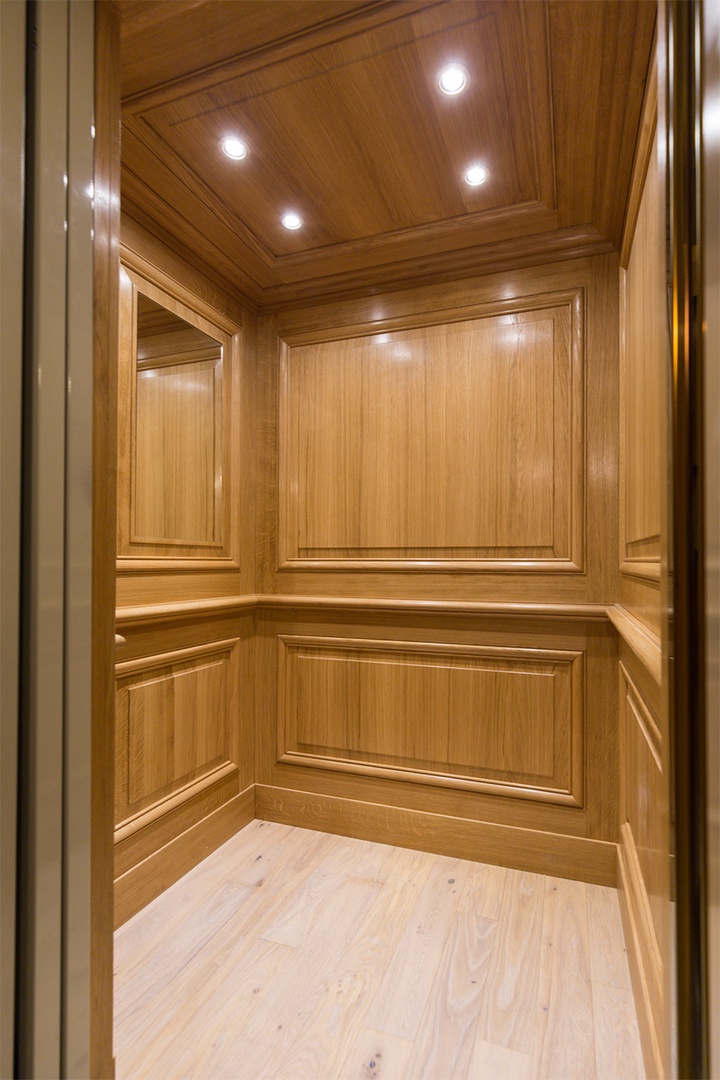 The modern elevator that can accommodate two guests and two suitcases.