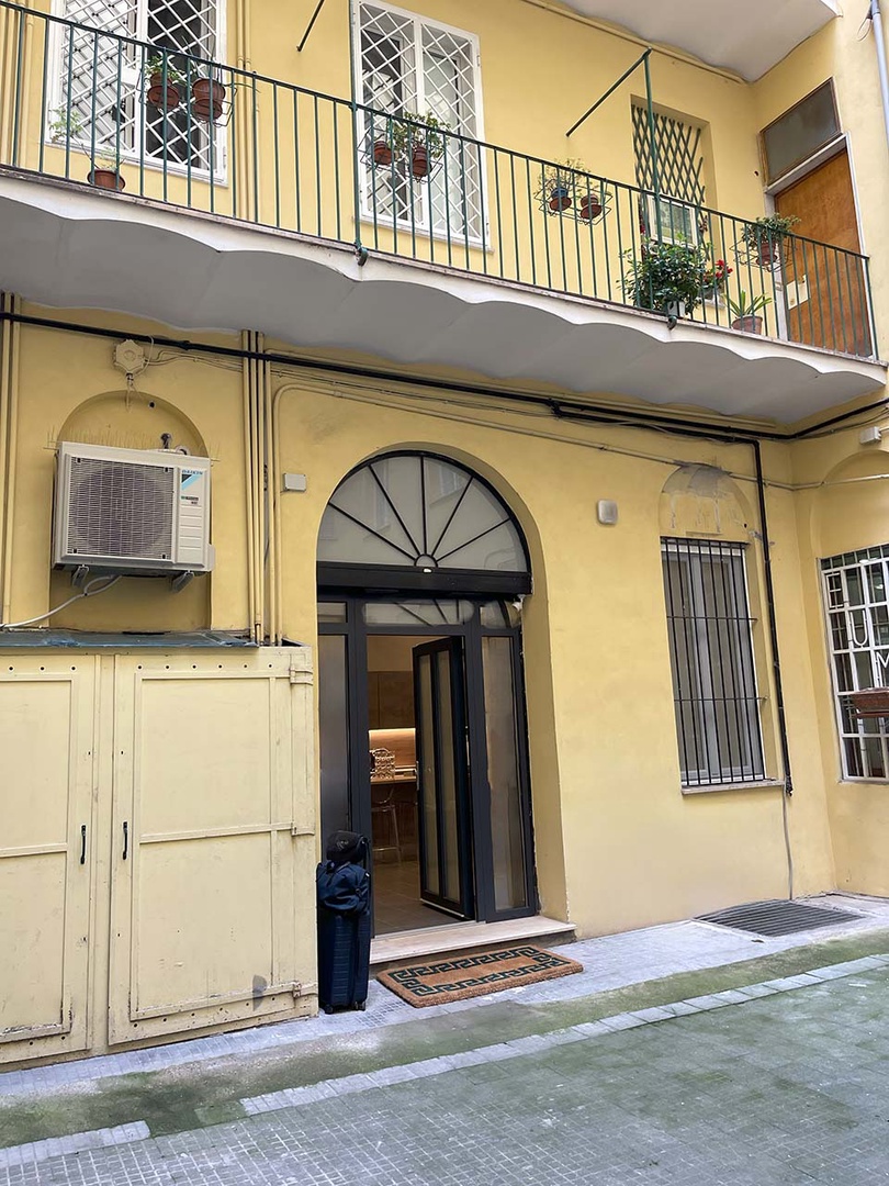 Entrance to apartment is off of a quaint courtyard.