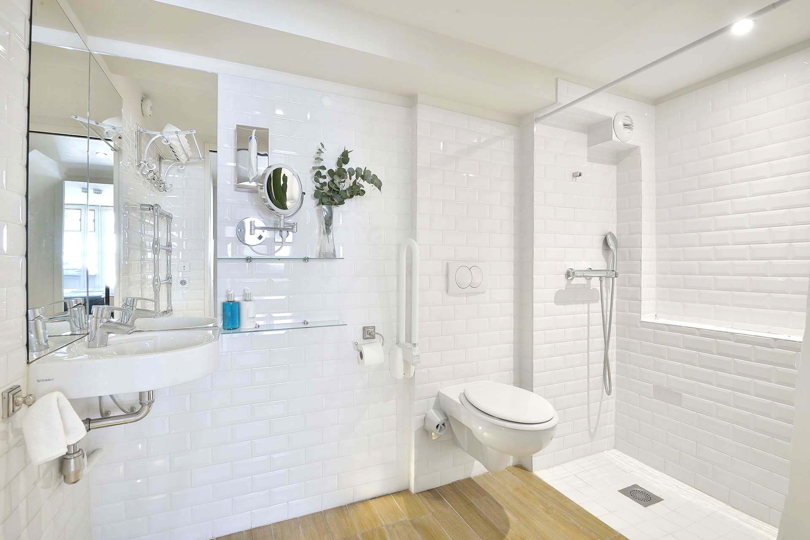 Spacious bathroom 2 has an open shower.