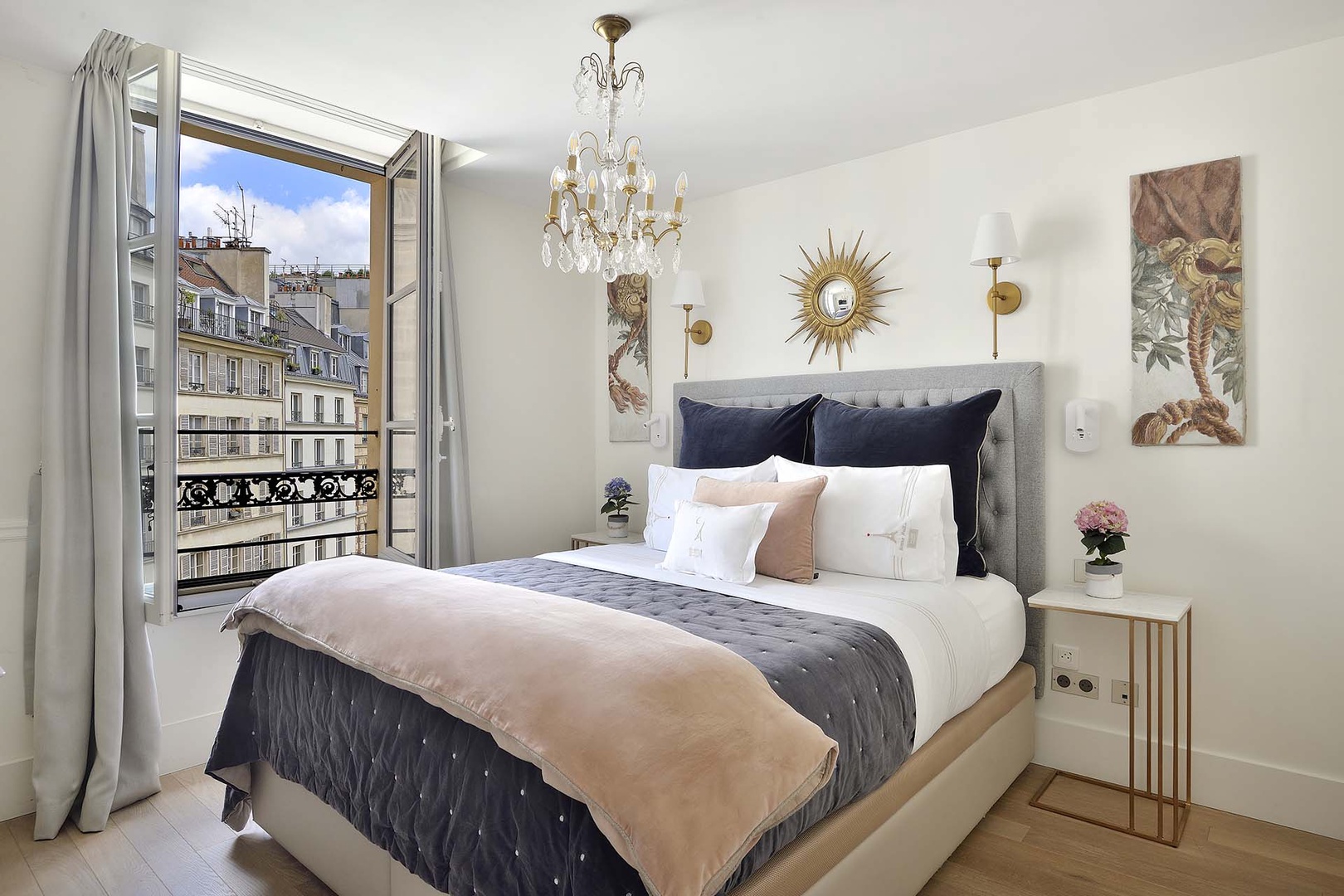 The bedroom is spacious and has a romantic feel.