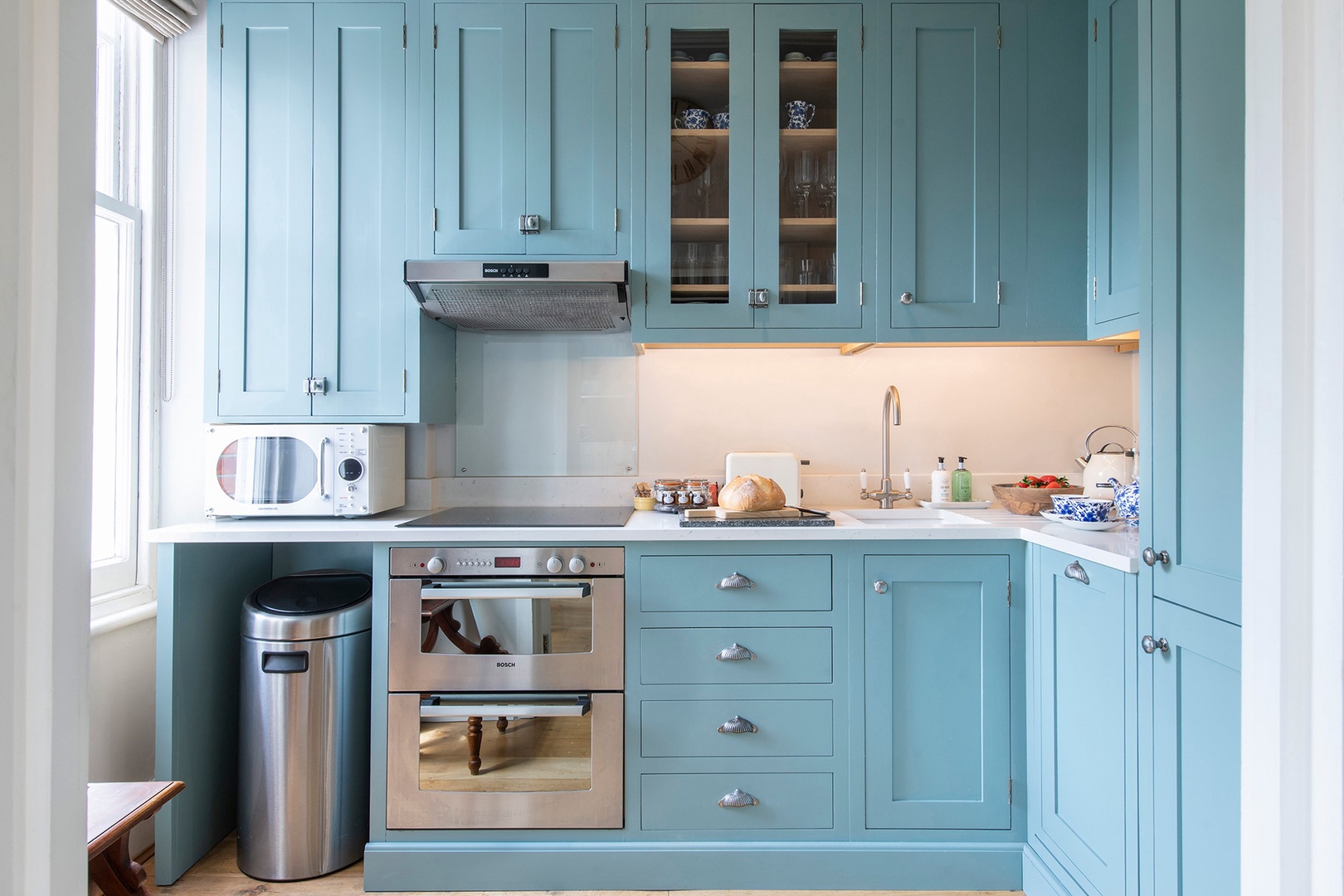 Fully-equipped kitchen has a lovely style.