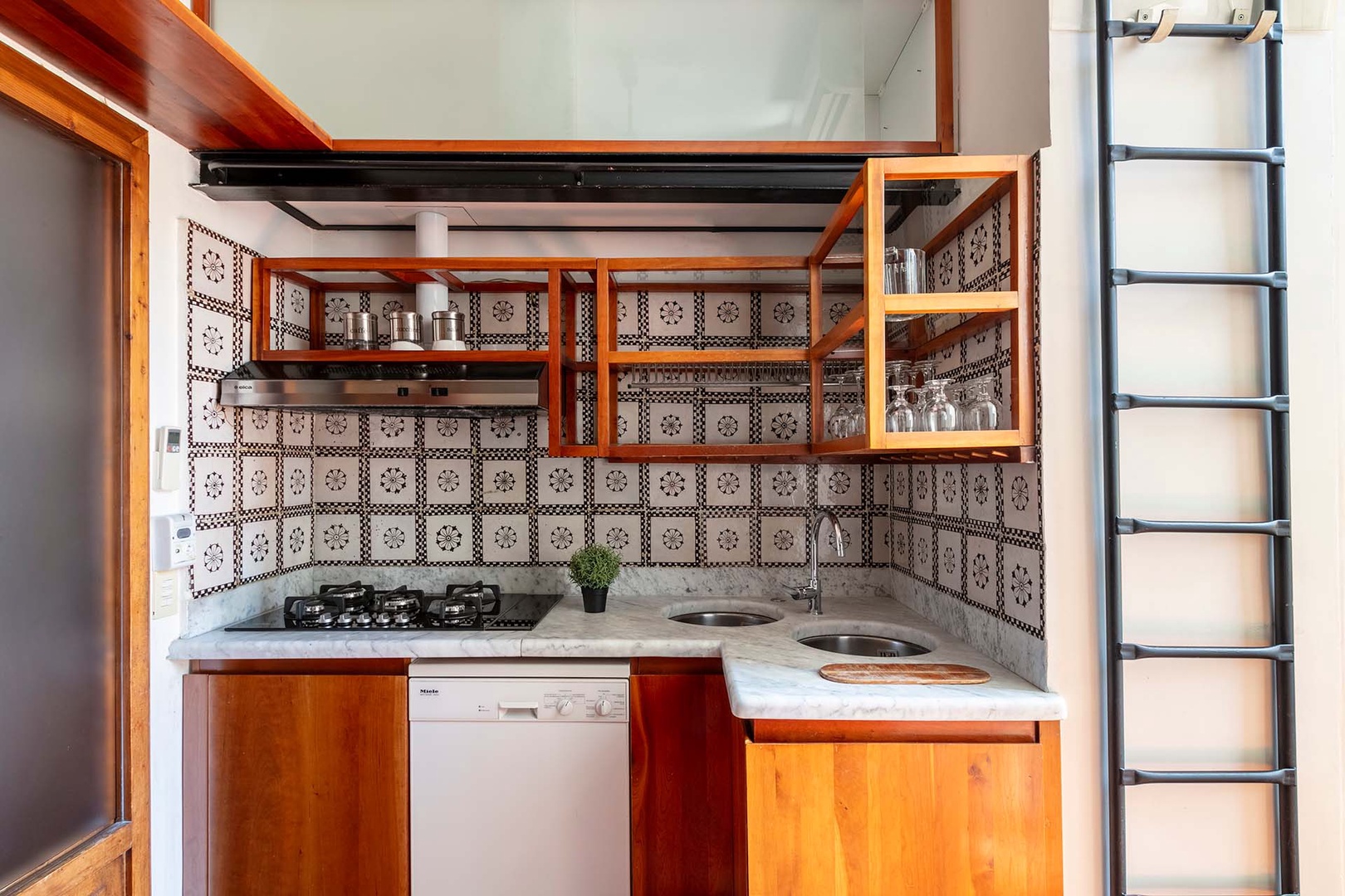 Kitchen is well-stocked. Marble countertops and all essential kitchen appliances.