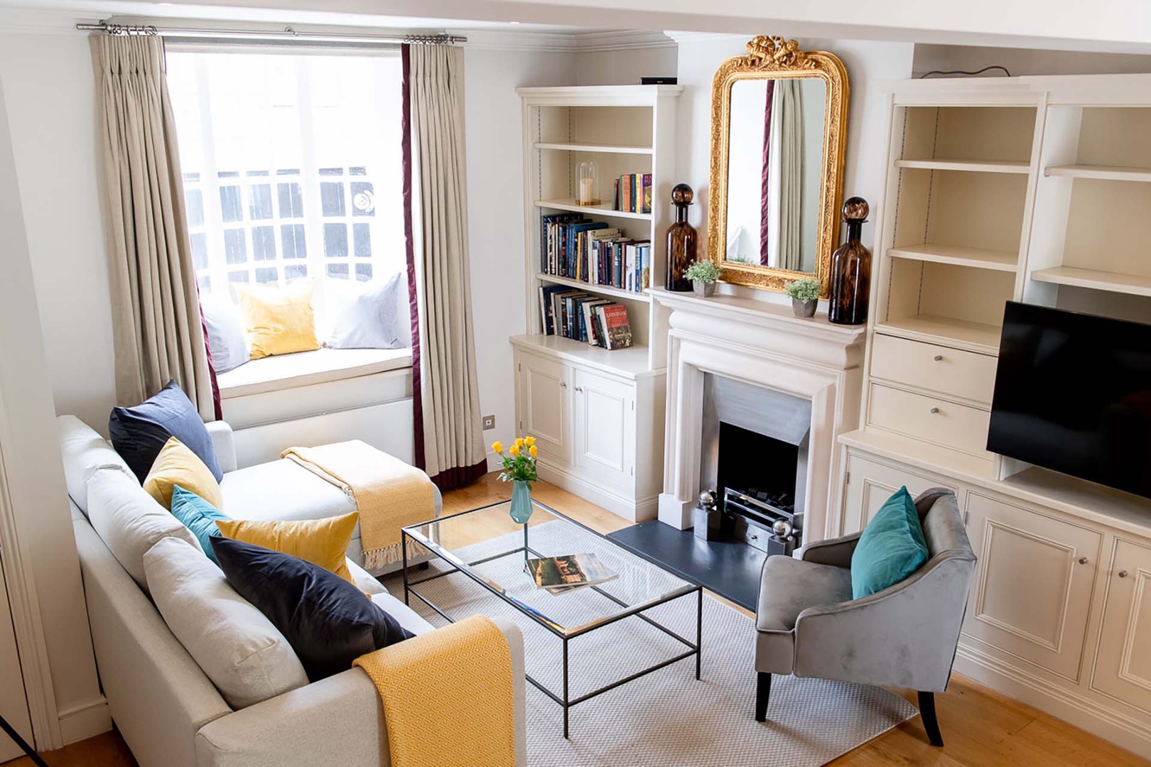 Cute bay window seating area and lovely light in living room.