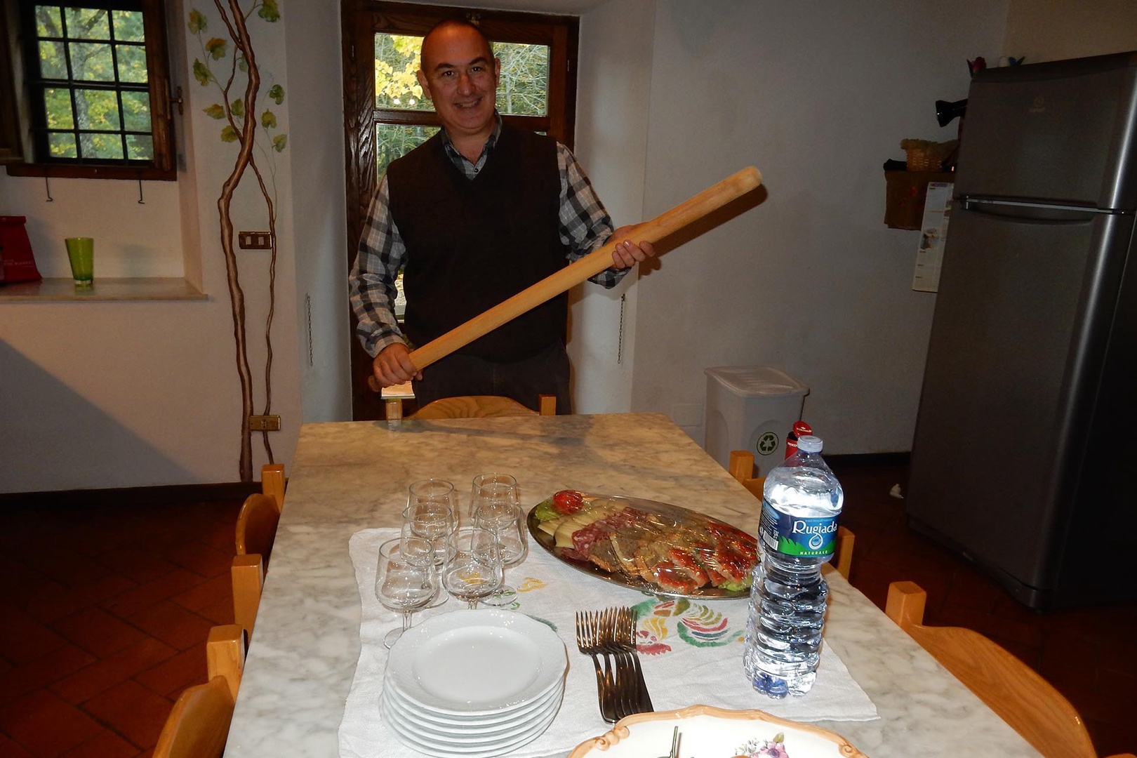 The 6 person kitchen table has a marble counter-top, perfect for rolling out pasta.