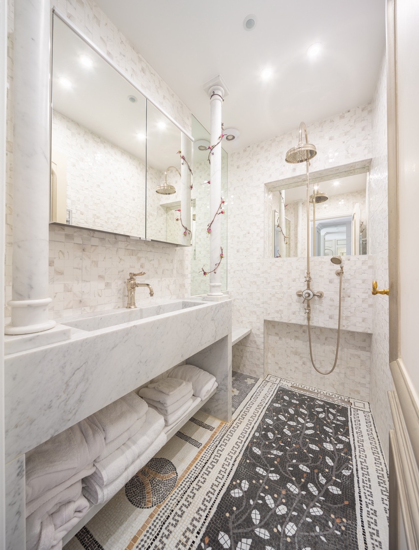 The bathroom comes with modern amenities and traditional charm.