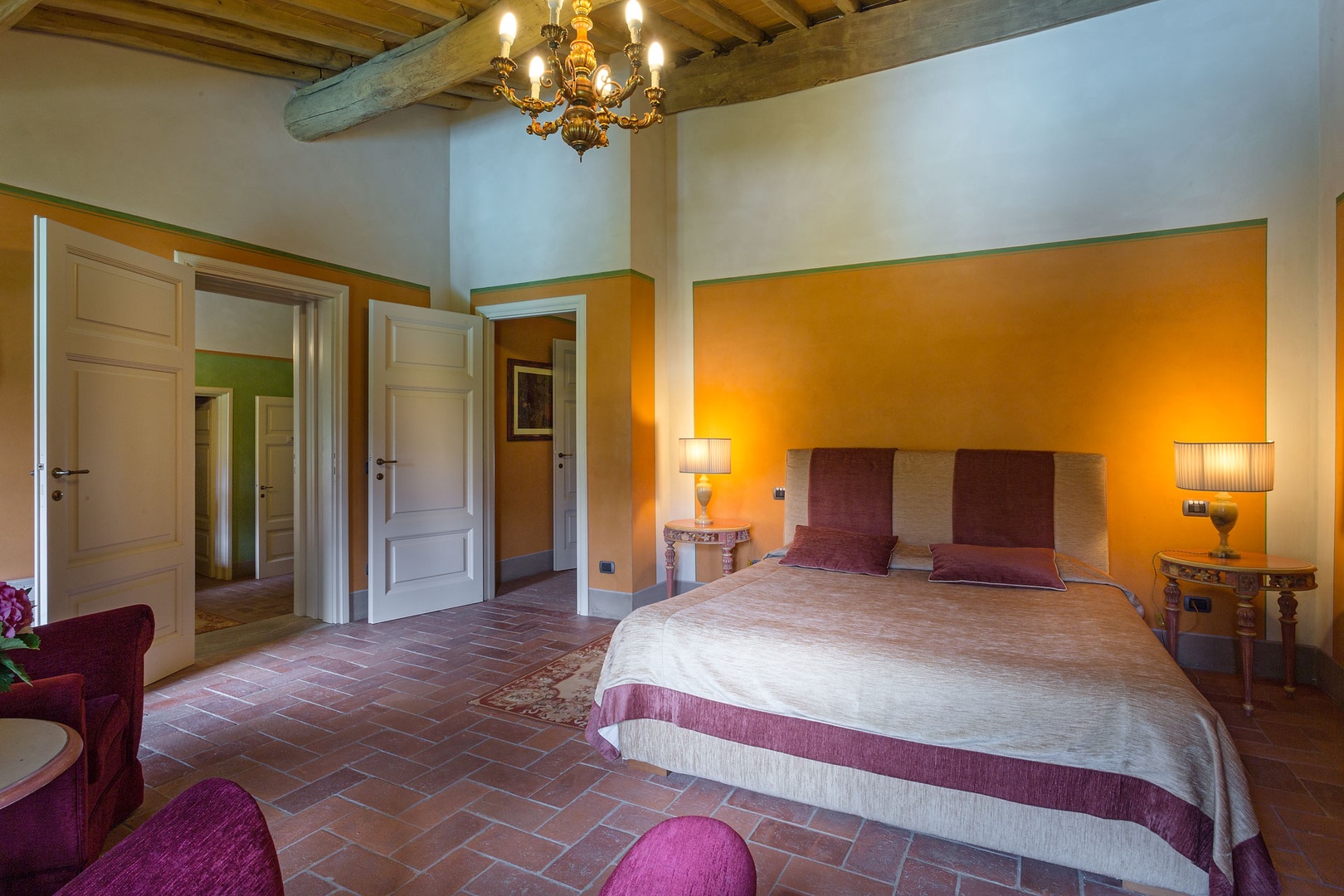 Bedroom with large bed and high ceilings