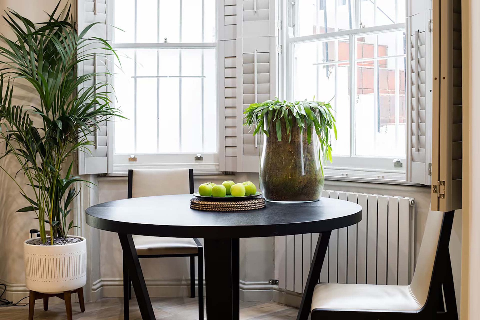 Beautiful light in the dining area of this garden level apartment.