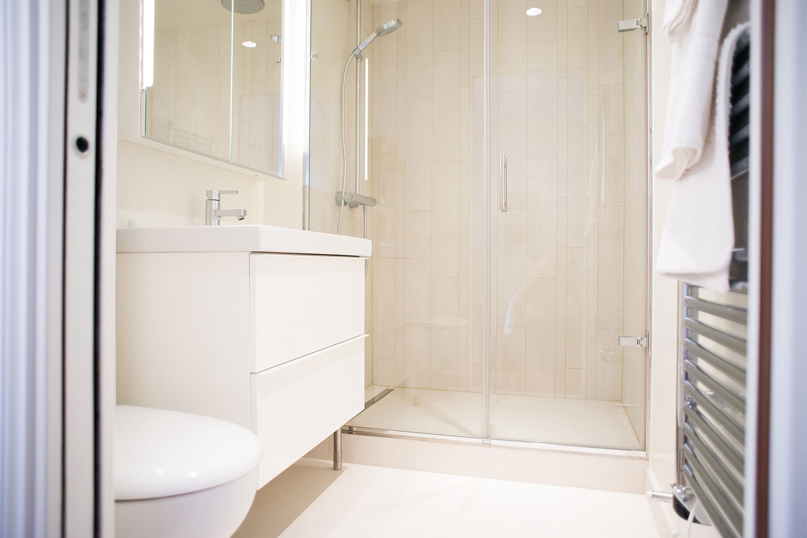 The luxurious en suite bathroom has a shower, sink and toilet.