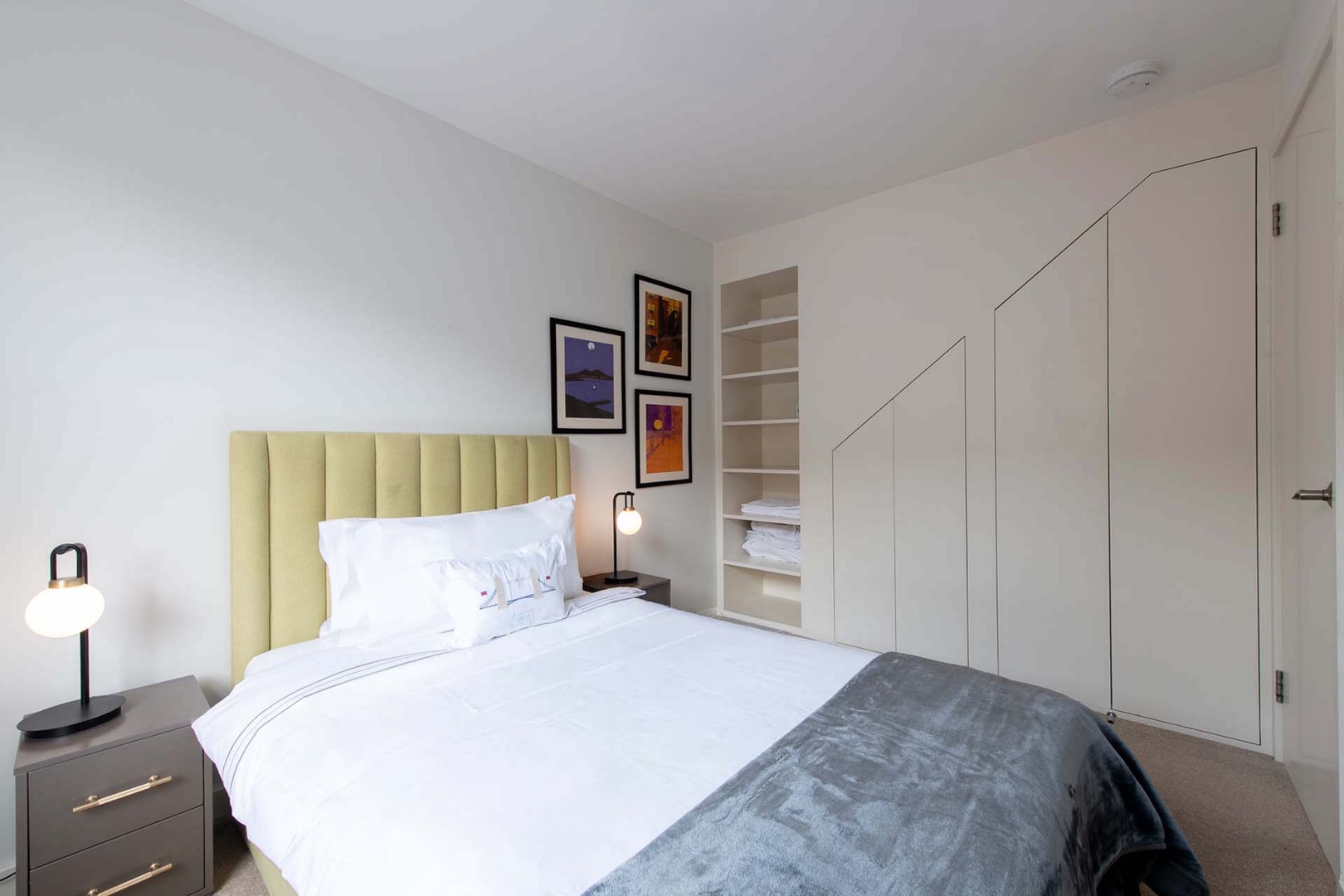 Plenty of built-in storage and colorful details in bedroom 3.