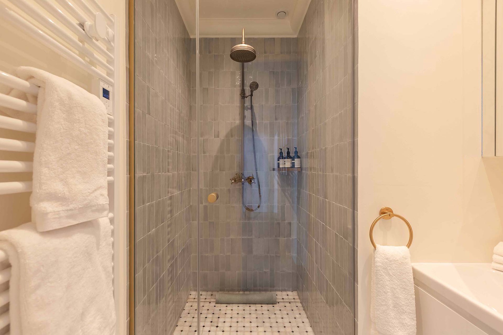 Bathroom 2 has a shower and sink. Toilet in separate powder room.