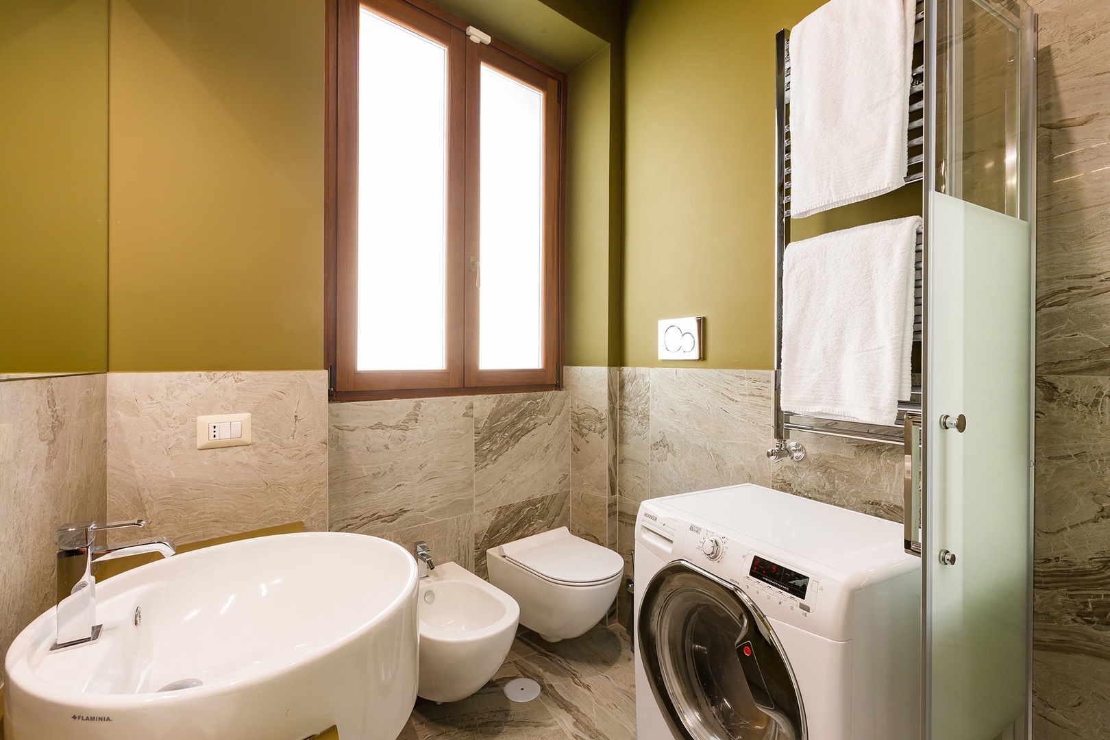 Bathroom 2 has a combination washer and dryer.