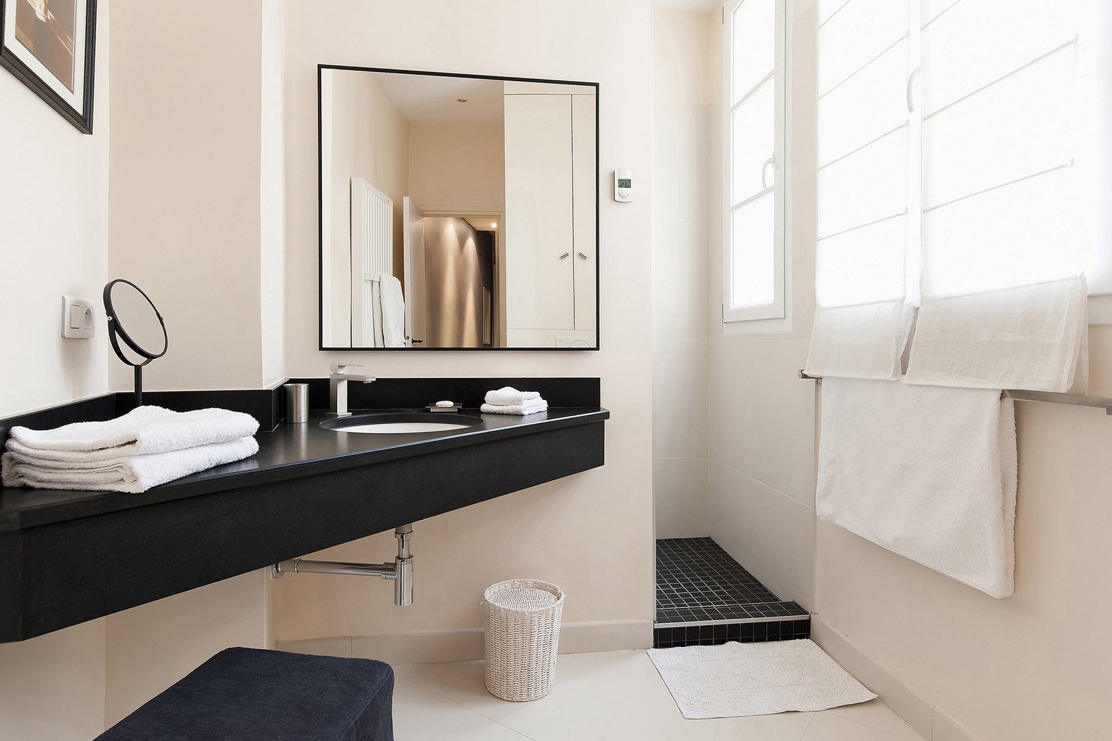 Start your day in this modern and sunny bathroom.