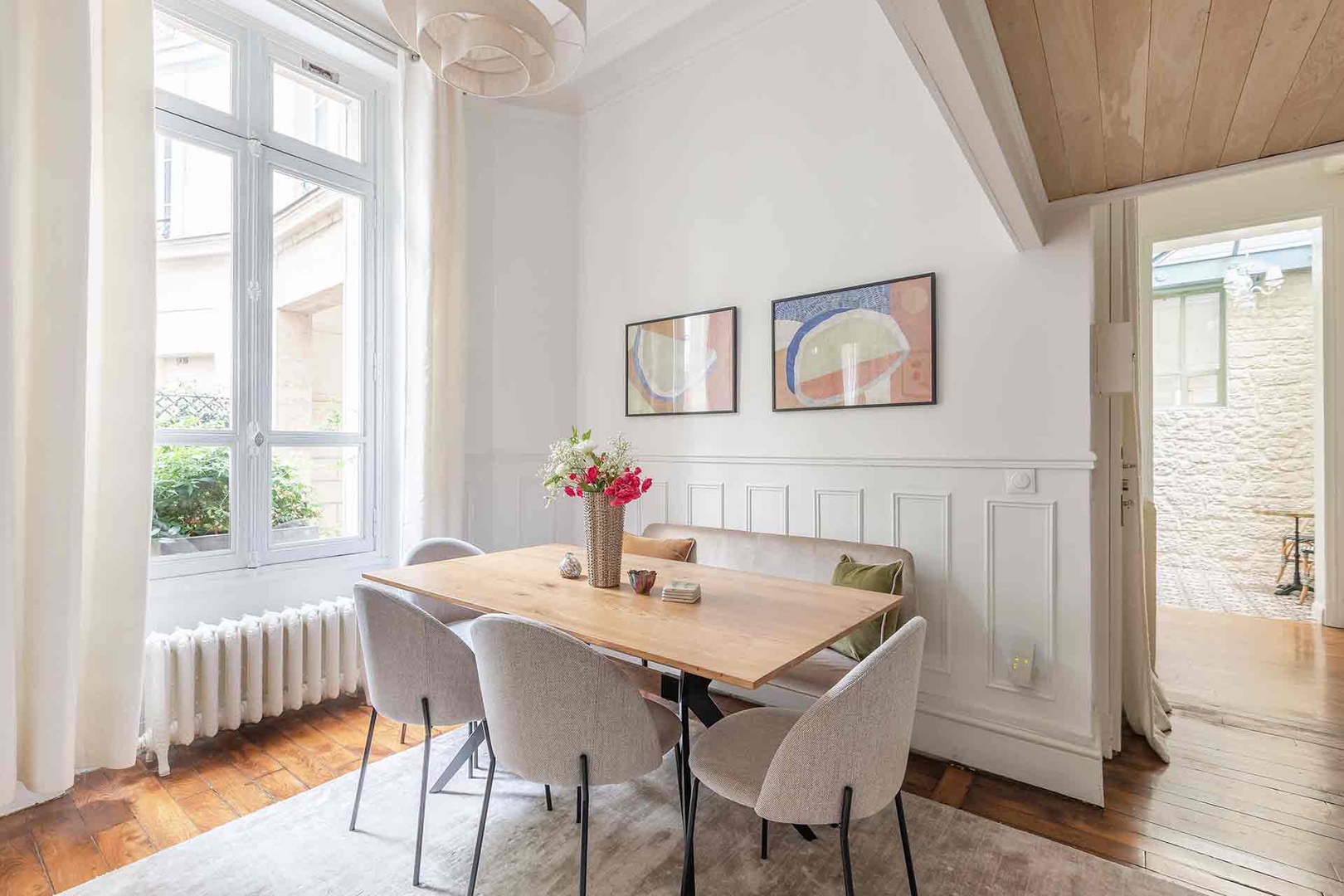 Separate dining room with loads of light.