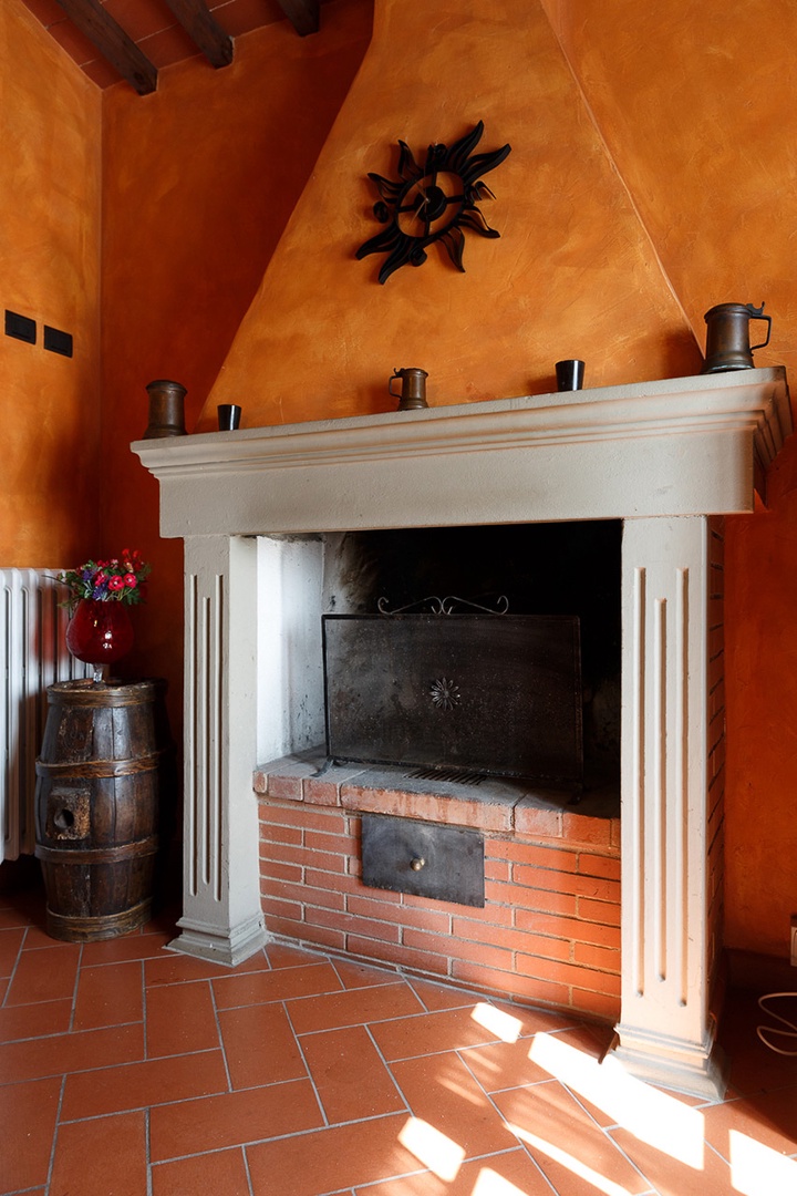 Kitchen has an original wood burning fireplace.