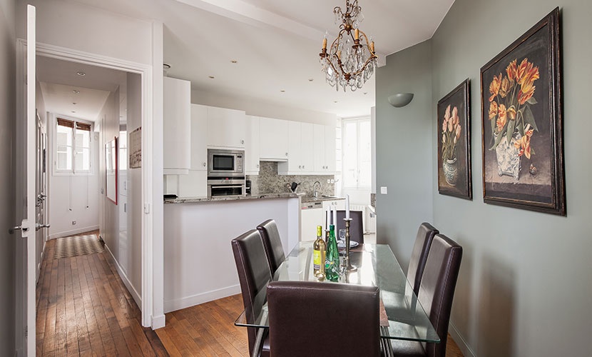 The comfortable dining area is conveniently set near the kitchen.