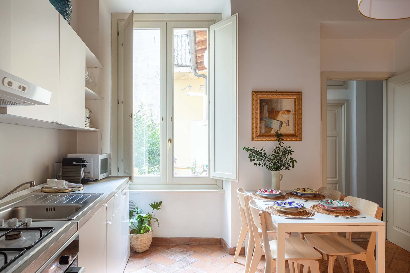 Kitchen is full of light and has a view to the private terrace.