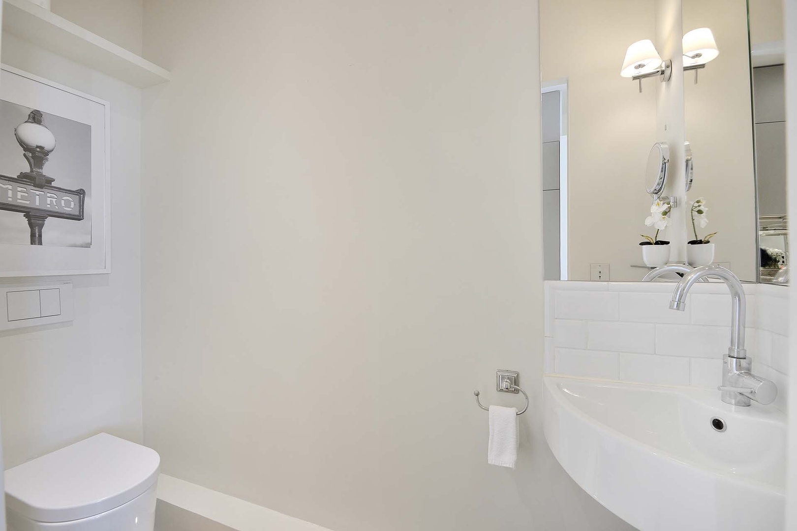 There is a practical separate half bath next to the kitchen.
