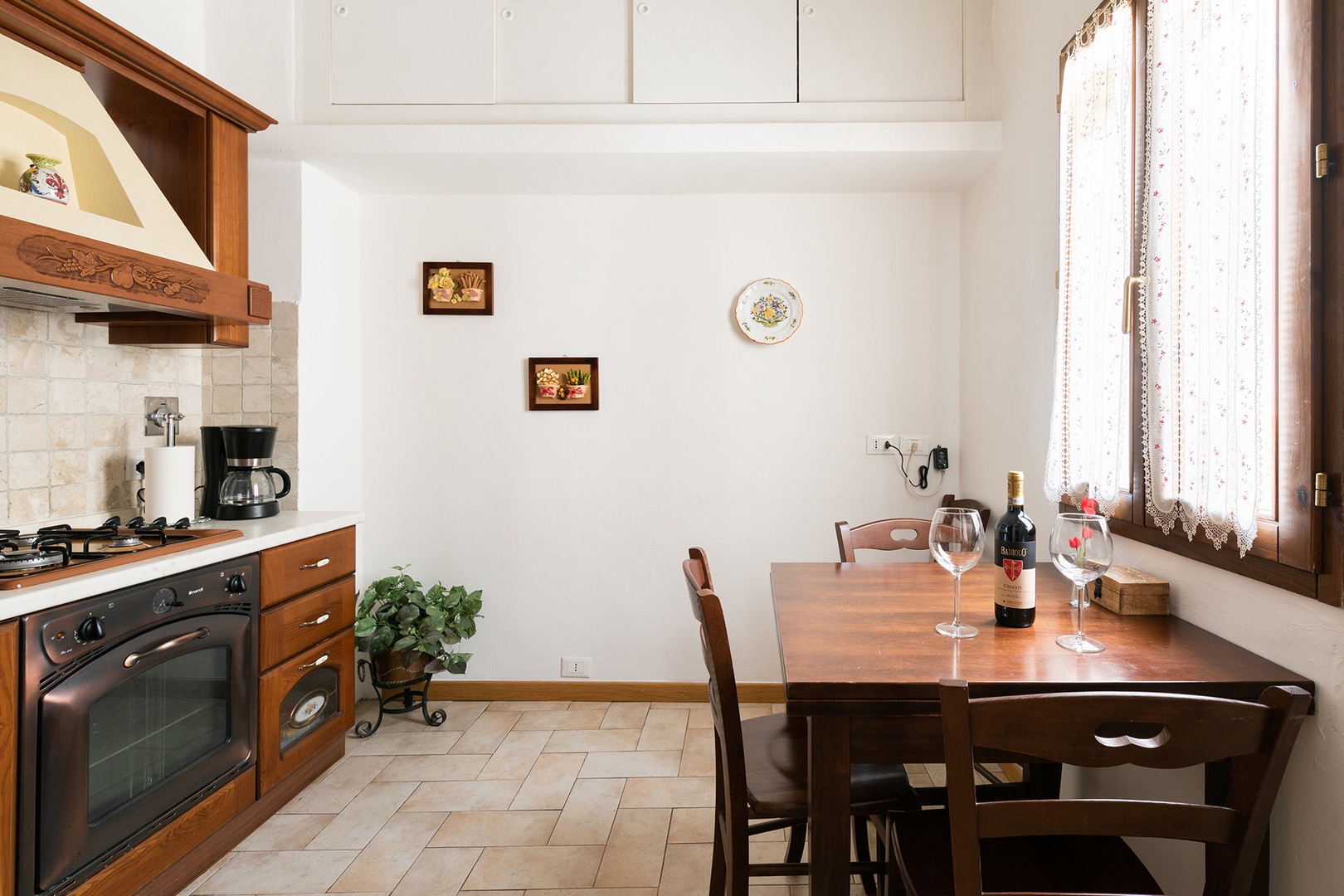 Eat-in kitchen has expandable table and seating for 4.