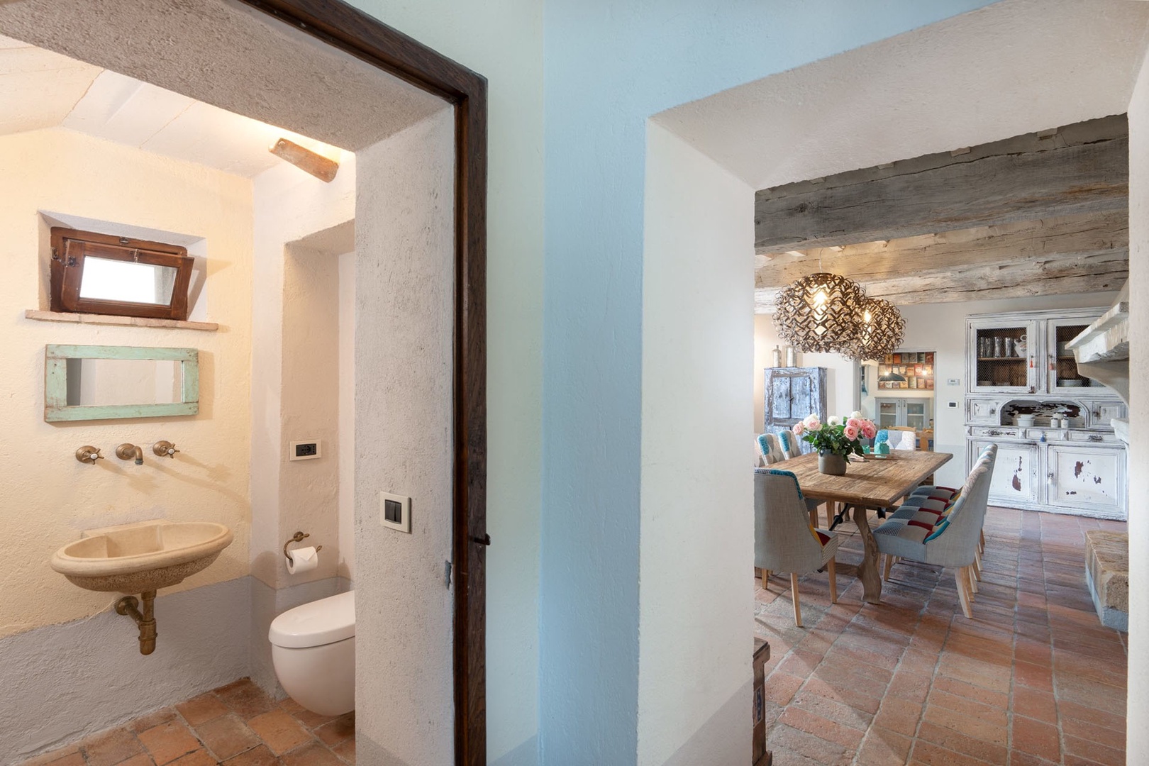 Half bath near dining area and sitting room