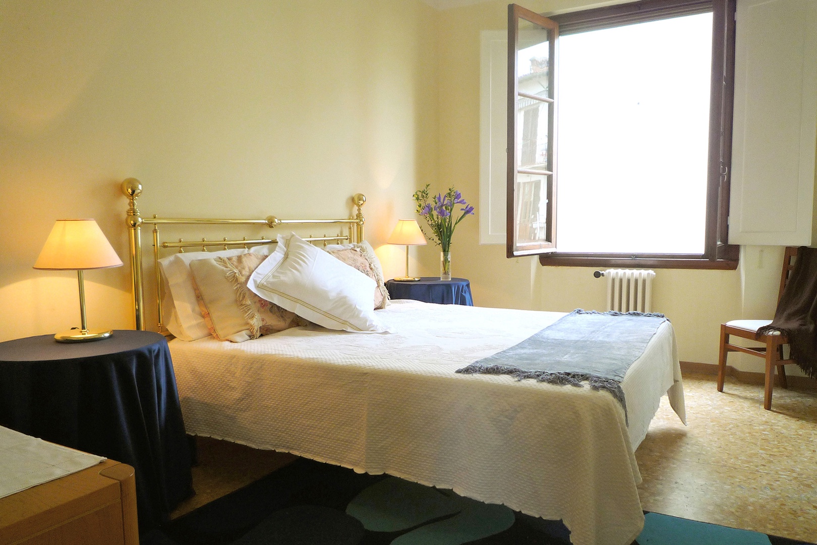 Bedroom 1 with a window that overlooks neighboring gardens below. Adjoining en suite bathroom.