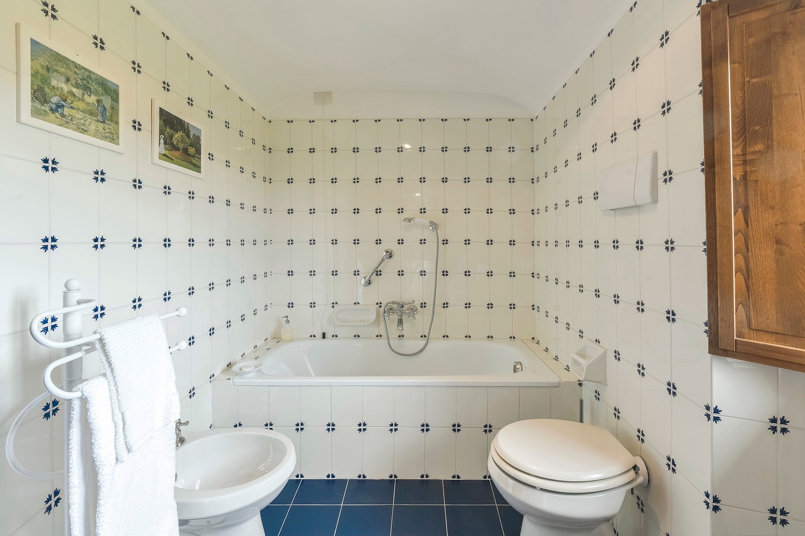 Bathroom 3 has a tub with handheld showerhead.