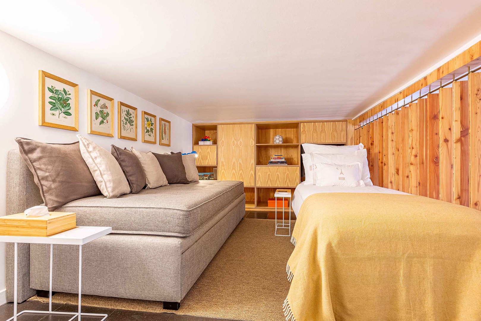 The sofa on the mezzanine can also be used for extra sleeping space.
