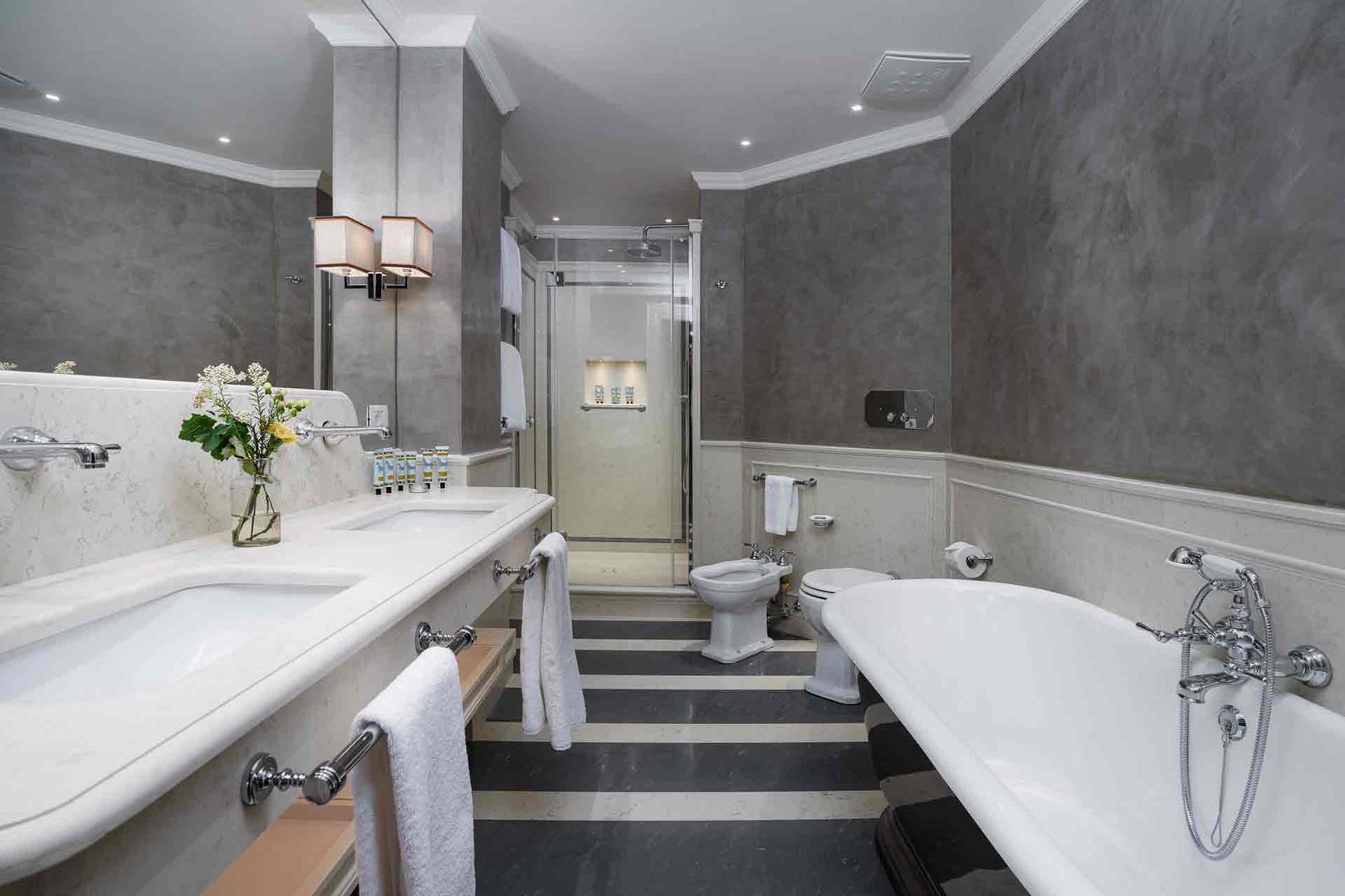 Bathroom 1 in close proximity to bedroom with shower and bathtub.