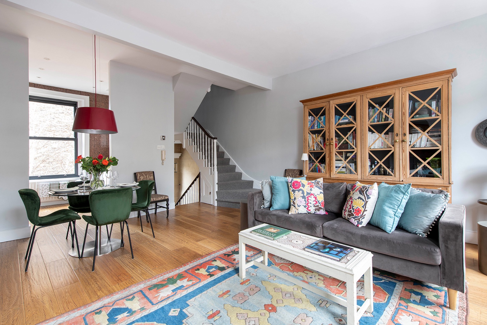 Steps from the living room lead up to the bedrooms and bathroom.