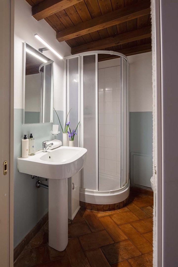 Bathroom 1 off the living room with the washer/dryer combo.