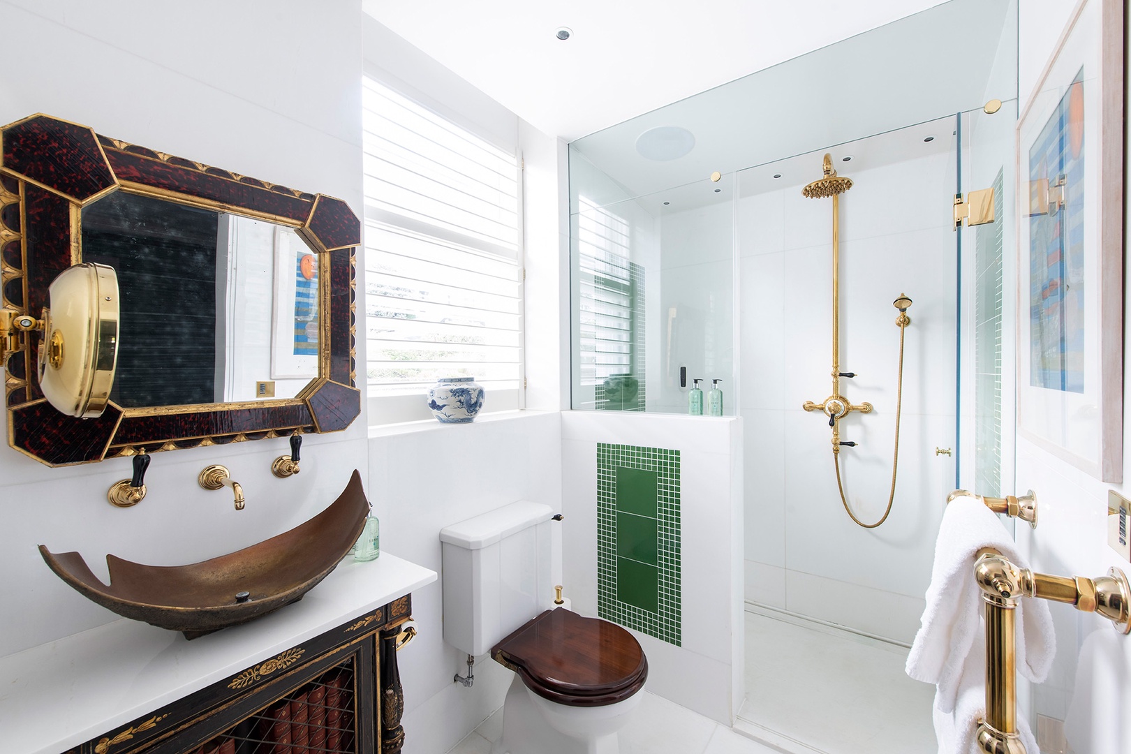 En suite bathroom with statement sink and shower.