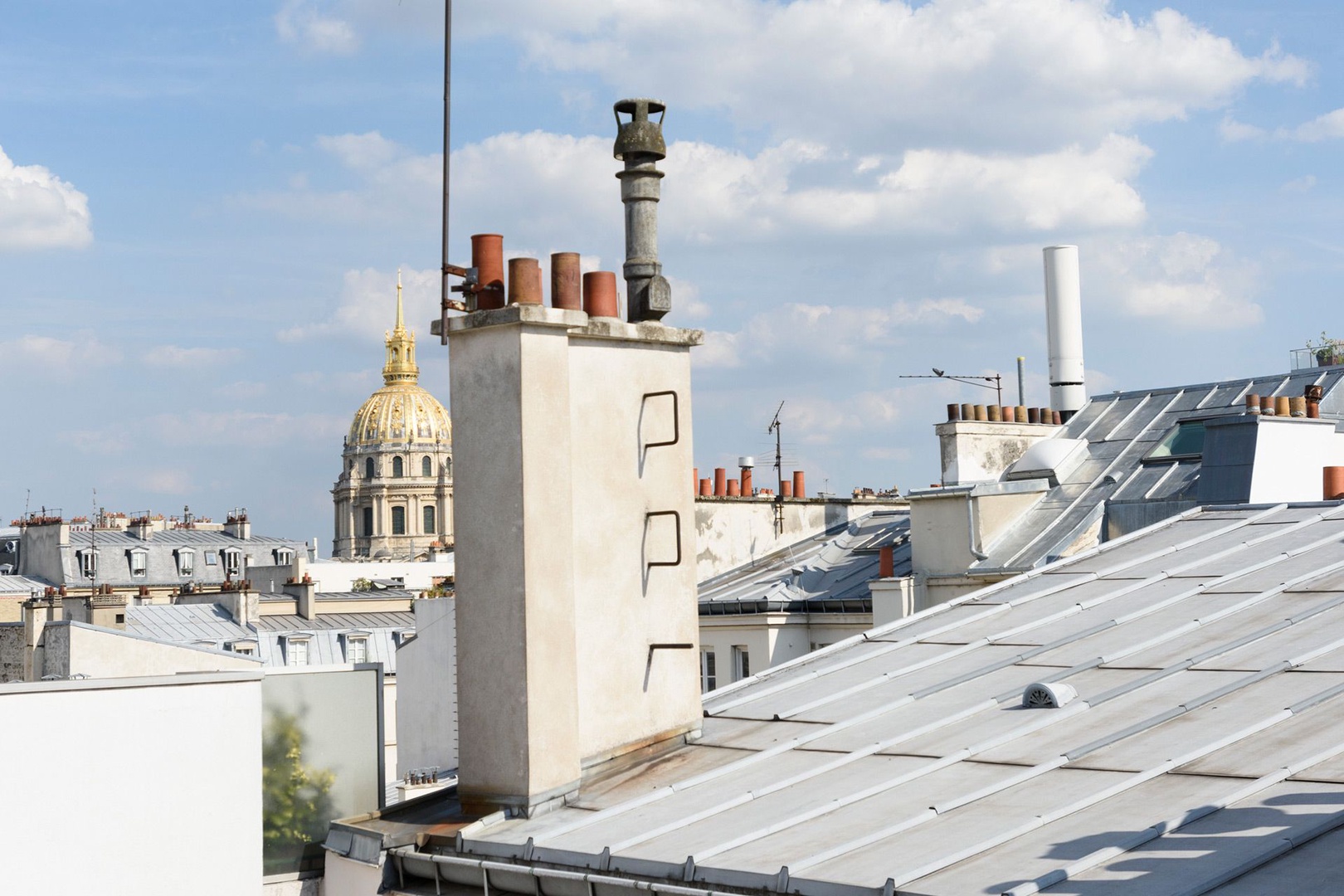 Enjoy the view of Parisian rooftops and Les Invalides.