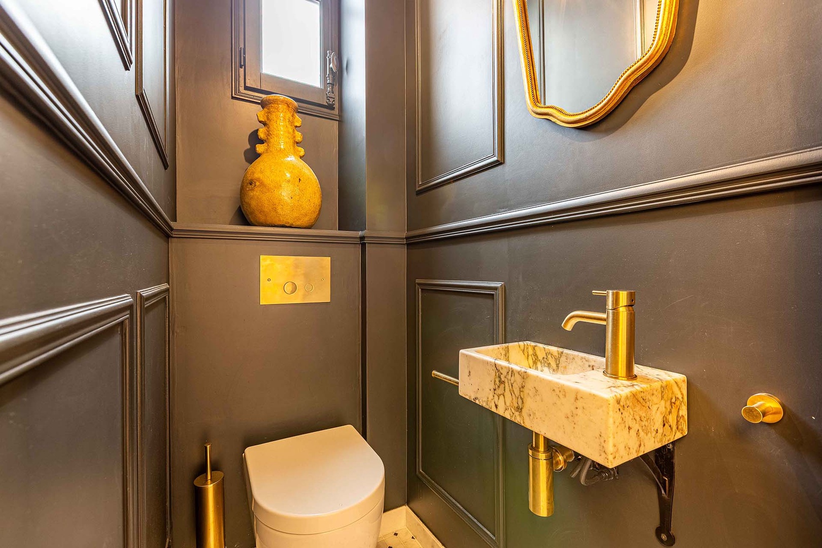 Powder room located near entryway.