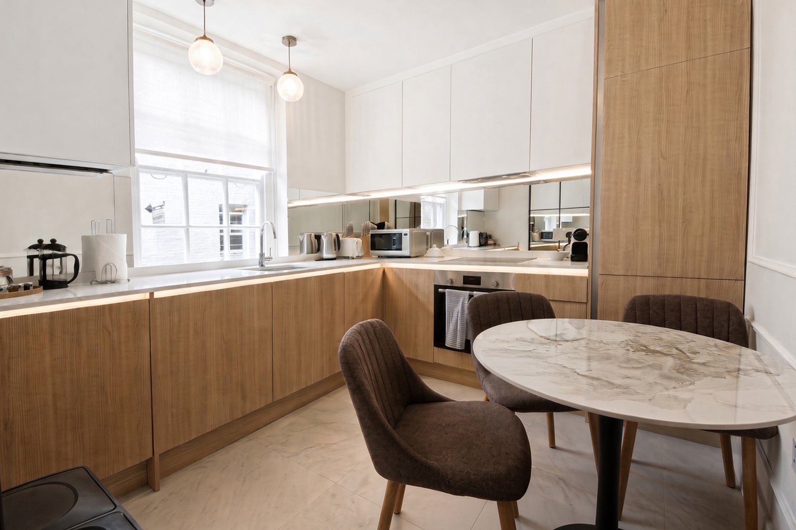 Gorgeous modern kitchen with dining table.