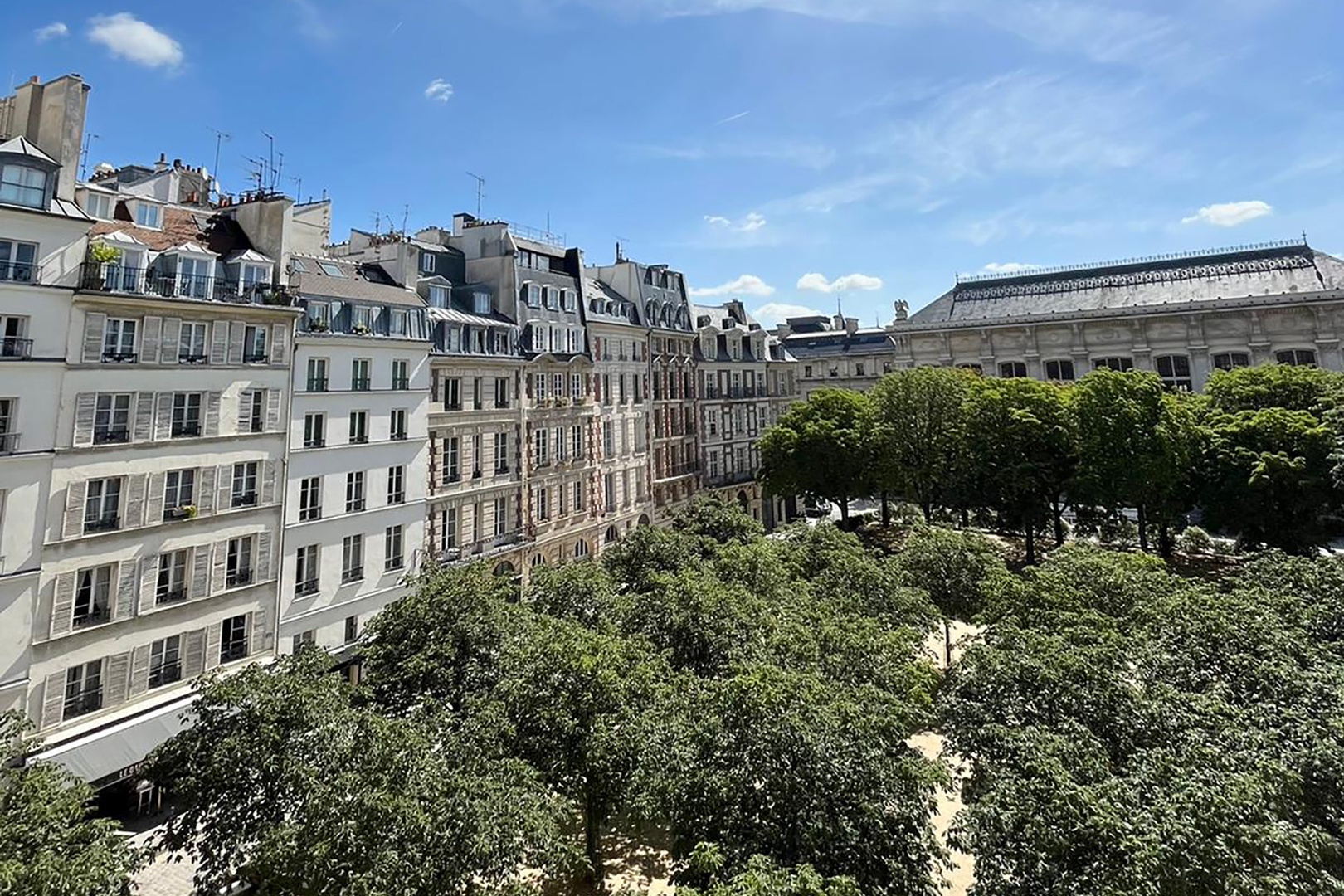 Enjoy a picturesque view of pretty Place Dauphine.