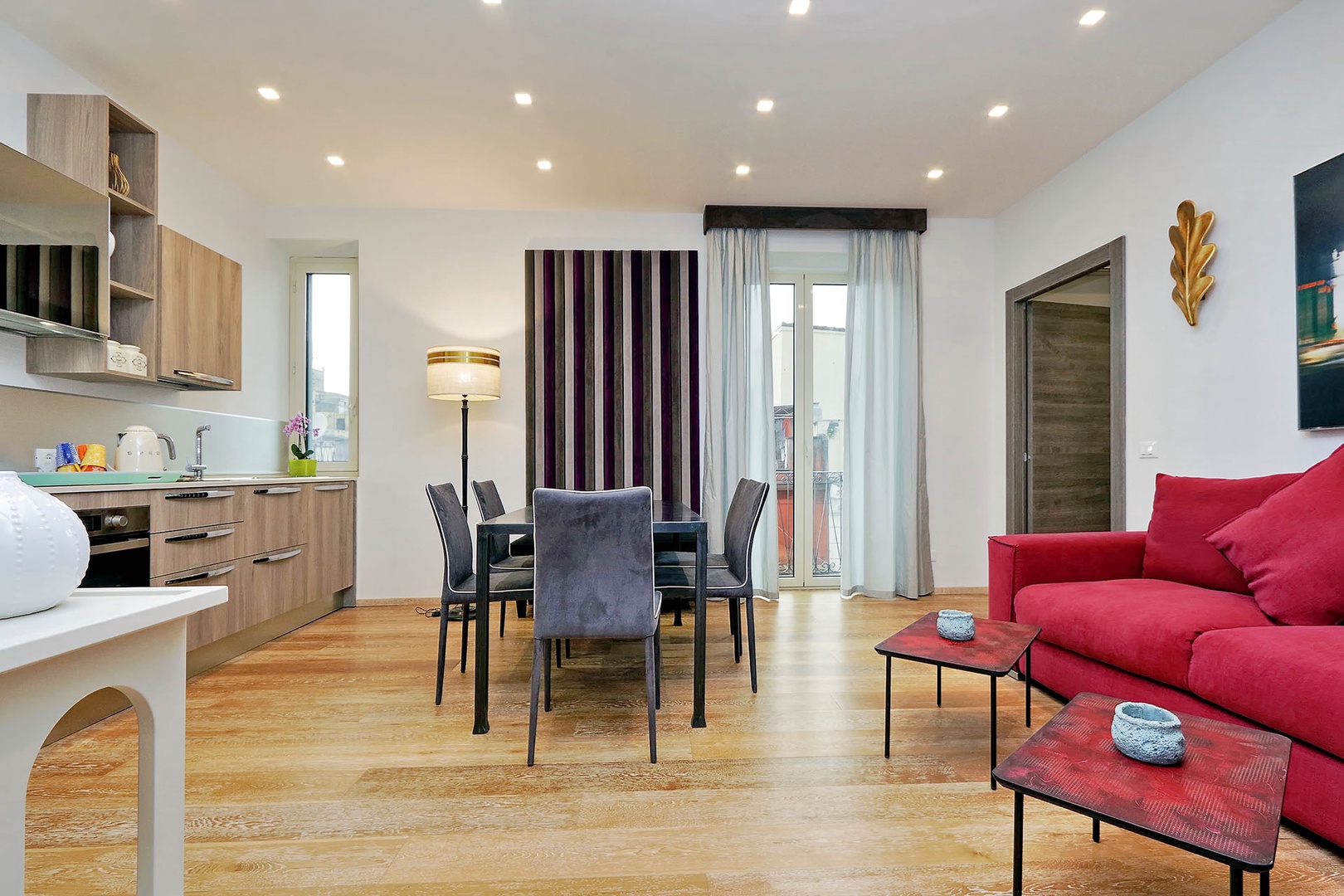 Next door, the Vita apartment has a spacious open plan living area.